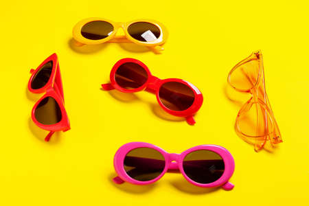 Stylish sunglasses on color backgroundの写真素材