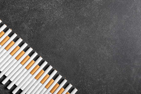 Many cigarettes on dark backgroundの写真素材