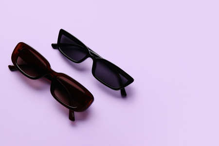 Stylish sunglasses on color backgroundの写真素材