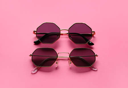 Stylish sunglasses on color backgroundの写真素材
