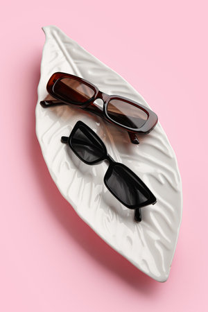 Stylish sunglasses on color backgroundの写真素材