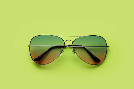 Stylish sunglasses on color backgroundの写真素材