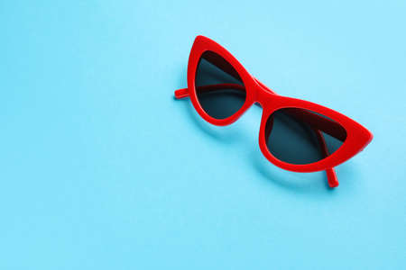 Stylish sunglasses on color backgroundの写真素材