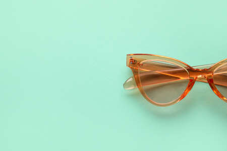 Stylish sunglasses on color backgroundの写真素材