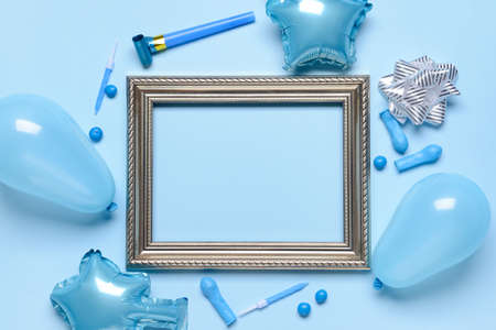 Composition with frame, balloons, candles and noisemaker on color backgroundの写真素材