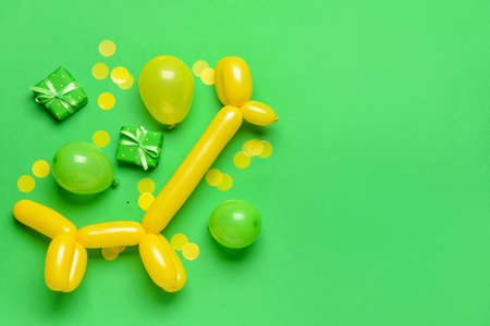 Composition with gift boxes, balloons and confetti on color background