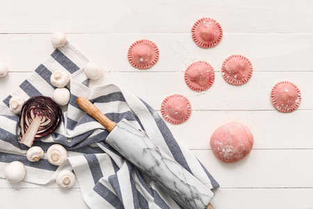 Raw ravioli on light wooden backgroundの写真素材