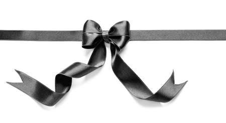 Black ribbon and bow on white backgroundの写真素材