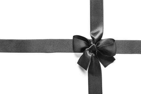 Black ribbons and bow on white backgroundの写真素材