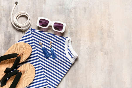 Set of female accessories with stylish sunglasses on grunge backgroundの写真素材