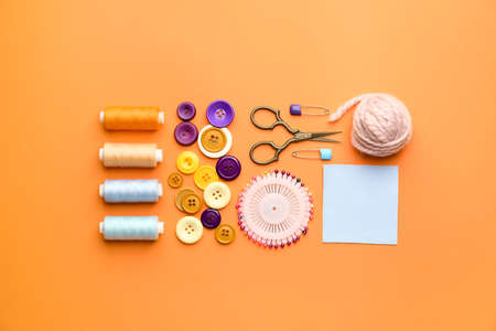 Composition with knitting supplies on color background