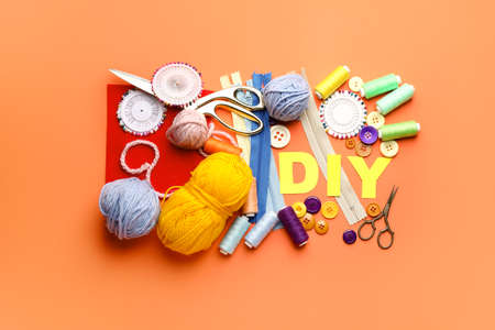 Composition with word DIY and knitting supplies on color backgroundの写真素材
