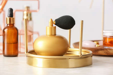 Bottle of aromatic perfume on tableの写真素材