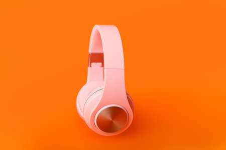 Modern headphones on color backgroundの写真素材