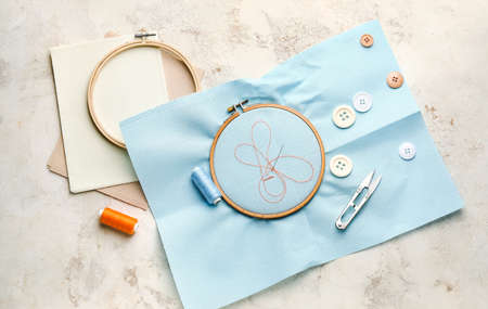 Embroidery hoops with canvas on light background