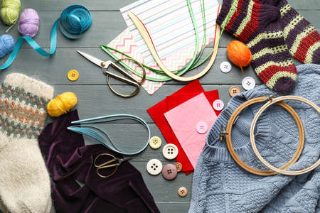 Composition with sewing supplies on gray wooden backgroundの写真素材