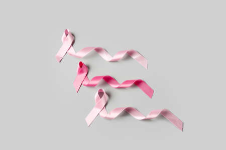 Pink ribbons on gray background. Breast cancer conceptの写真素材
