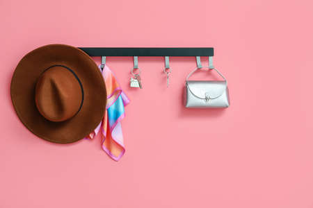 Rack with accessories and keys hanging on color wallの写真素材