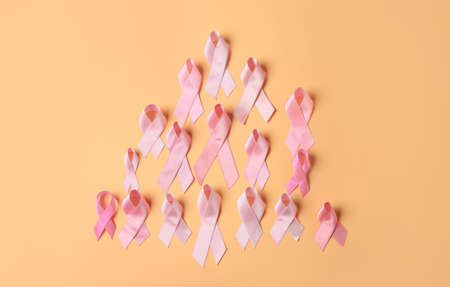 Pink ribbons on color background. Breast cancer concept