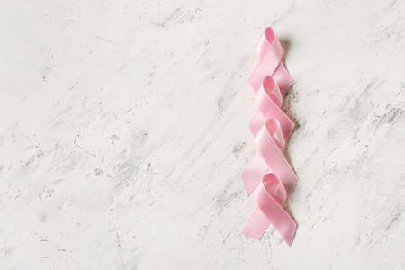 Pink ribbons on light background. Breast cancer concept