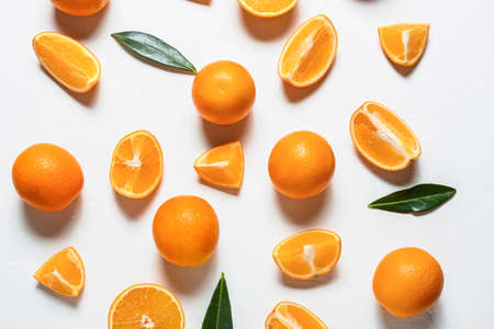 Fresh juicy oranges on light backgroundの写真素材