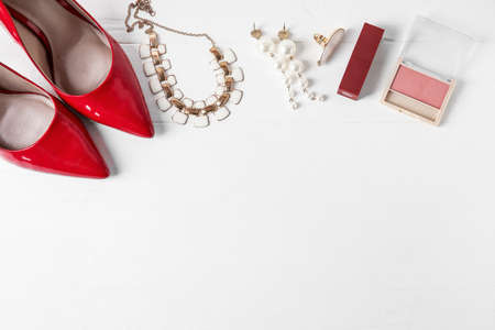 Set of female accessories and stylish shoes on white wooden backgroundの写真素材