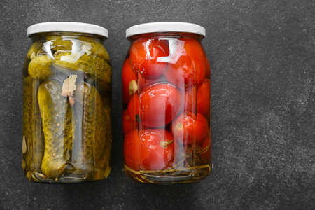 Jars with canned vegetables on dark backgroundの写真素材
