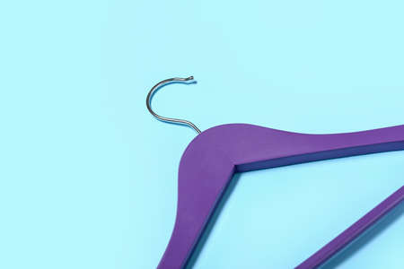 Stylish clothes hanger on color background, closeupの写真素材