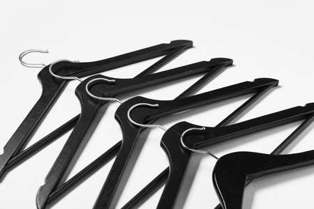Stylish clothes hangers on light backgroundの写真素材