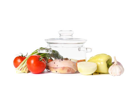 Stylish cooking pot and products on white backgroundの写真素材