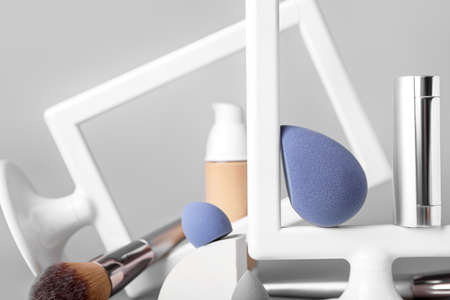 Makeup sponges with decor on light backgroundの写真素材