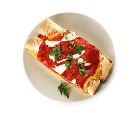 Plate with tasty cooked enchilada on white backgroundの写真素材