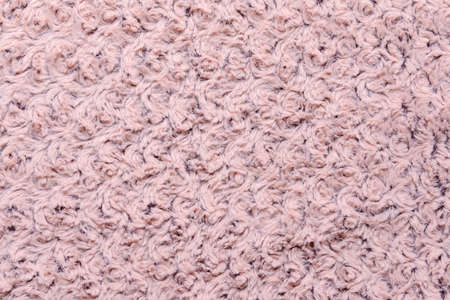 Texture of pink fluffy fabric, closeup