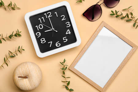 Composition with stylish clock and frame on color backgroundの写真素材