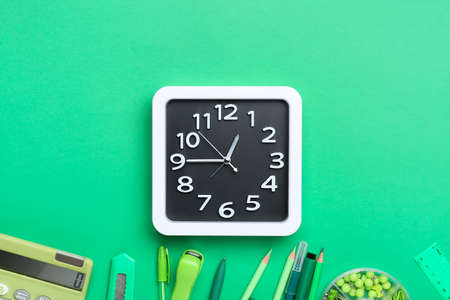Composition with stylish clock and stationery on color backgroundの写真素材