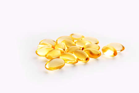 Fish oil capsules on white background