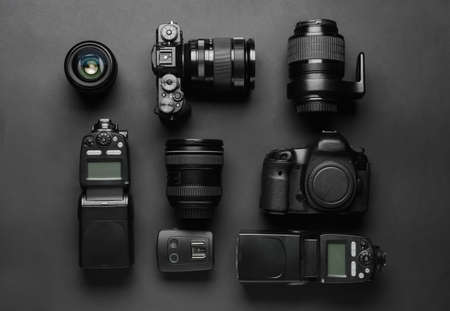 Modern photographer's equipment on dark backgroundの写真素材