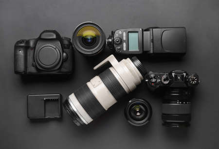 Modern photographer's equipment on dark backgroundの写真素材