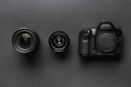 Digital camera and lenses on dark backgroundの写真素材
