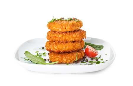 Plate with tasty lentil cutlets on white background
