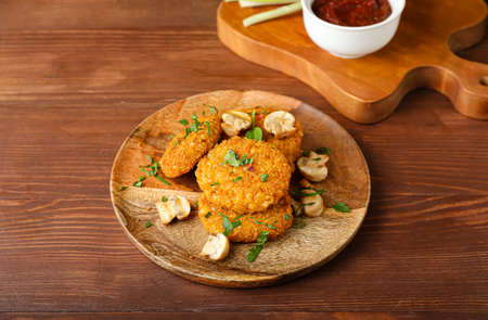 Plate with tasty lentil cutlets on tableの写真素材
