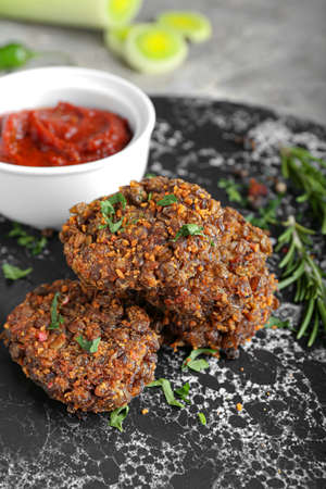 Tasty lentil cutlets on board, closeup