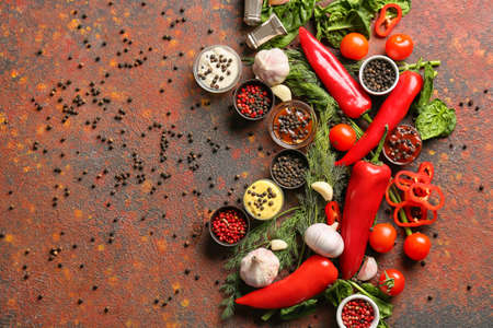 Bowls with different sauces and ingredients on grunge background
