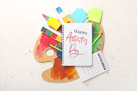Beautiful greeting card for Artist's Day with notebook and supplies