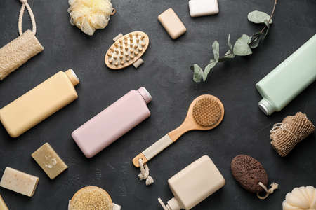 Bottles of cosmetic products and bath supplies on dark backgroundの写真素材