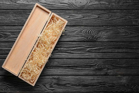 Open wine box on dark background