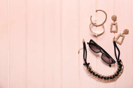 Set of female accessories on color wooden backgroundの写真素材