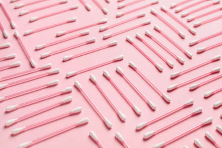 Cotton swabs on color background