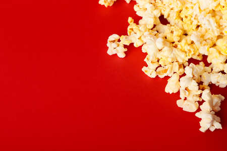 Tasty popcorn on color background, closeup