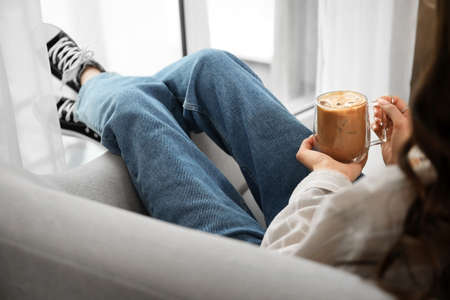 Woman drinking tasty coffee at home, closeupの写真素材